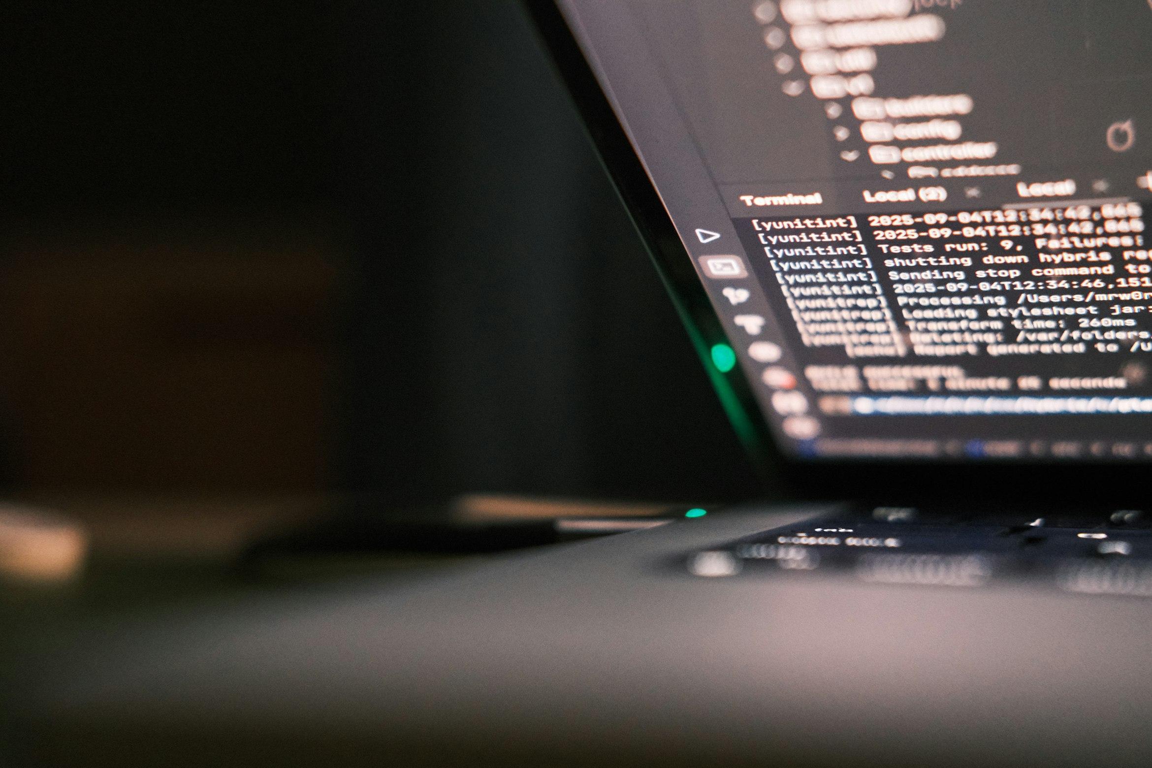 Developer working at a desk with a terminal workspace